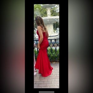 Size 8 Red prom dress with thigh high slit.